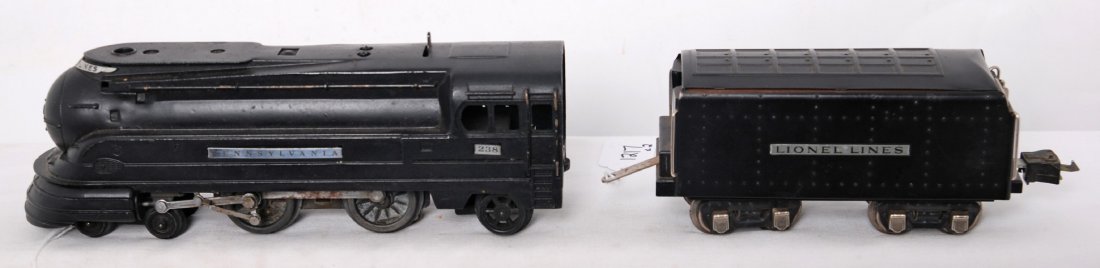 Lionel 238 Pennsylvania streamline and 265 tender: Prewar Lionel O gauge 238 Pennsylvania streamline steam locomotive with 265 waffle top tender. Tender does have a spot behind ladder that needs addressed and possibly some other touchups. Tender is op