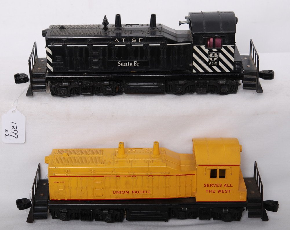 Lionel 616 A.T.S.F. and 635 U.P. NW-2 diesel swit: Postwar Lionel O gauge 616 A.T.S.F. Santa Fe and 635 Union Pacific, NW-2 diesel switcher locomotives. 616 has chipped cab roof edge, and cracked shell at nose, 635 has hairlines at screw. Train look C