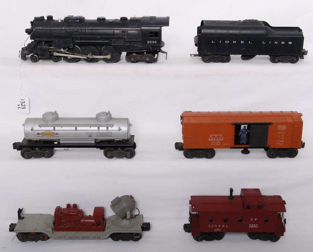 Lionel 1473WS w/2046, 2046W, 6465, 3464, 6520, 63: Postwar Lionel O gauge 1473WS steam freight set with 2046 steam locomotive, 2046W whistle tender, 6465 Sunoco tank, 3464 New York Central operating boxcar, 6520 searchlight car, and 6357 S.P. caboose.