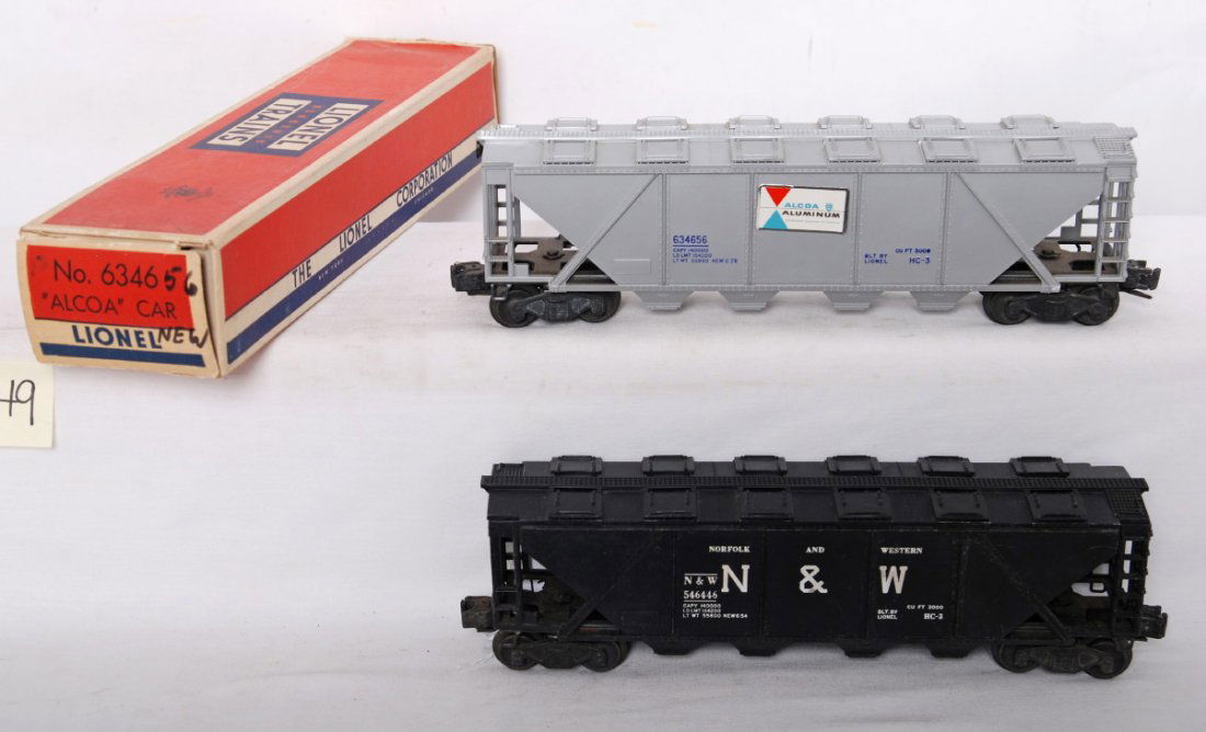Lionel 6346 Alcoa in OB and 6446 N&W no box: Postwar Lionel O gauge 6346 Alcoa covered cement car in original box and 6446 Norfolk and Western covered hopper without box, C6-7. 6346 has some chipping to upper edge of shell. 6446 has minor specks