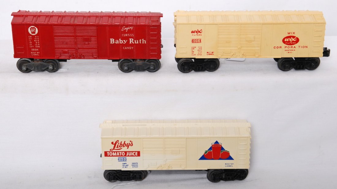 Lionel 6014 Wix, 6050 LibbyÕs, and 6014 Baby Ruth: Postwar Lionel O gauge 6014 Wix, 6050 LibbyÕs with coin slot (missing catwalk end, hairline at screw), and 6014 PRR Baby Ruth (hairline in corners, at screw, and at mounting slot), 9 inch boxcars, C5