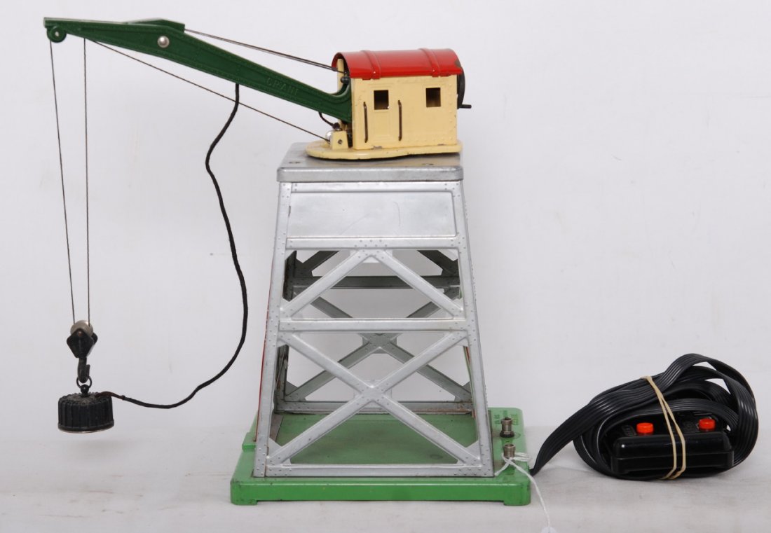 Lionel 165 remote control magnetic crane w/contro: Postwar Lionel O gauge 165 remote control magnetic crane with nicely rewired controller. Controller is missing small piece from one side, C6.