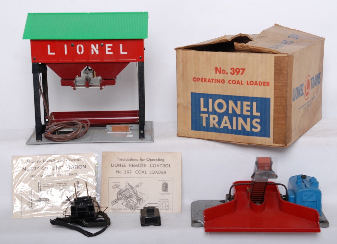 Lionel 397 and 497 coal loaders, 397 in OB: Postwar Lionel O gauge 397 operating coal loader in original box with instructions sheet and 364C (chipped corner). 397 has specks of light surface rust, C6. Box looks C7 area. 497 coal loader with co