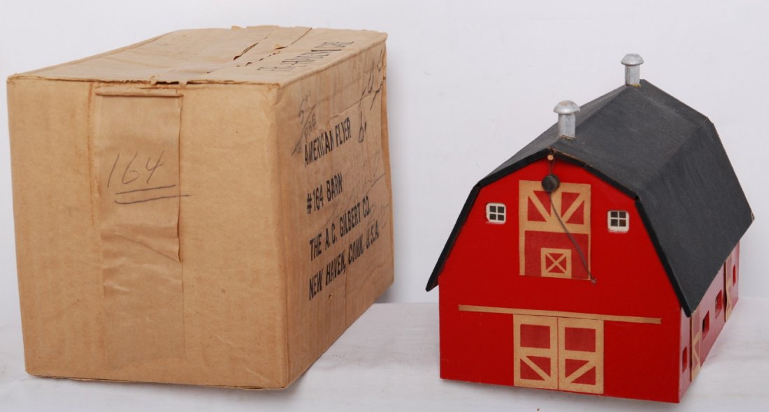 American Flyer 164 barn in original box: American Flyer postwar S gauge 164 barn in OB. Barn is C7+ with some light wear and roof edges. OB has some prices marked on the box. Box has all flaps and some light warping and wear.