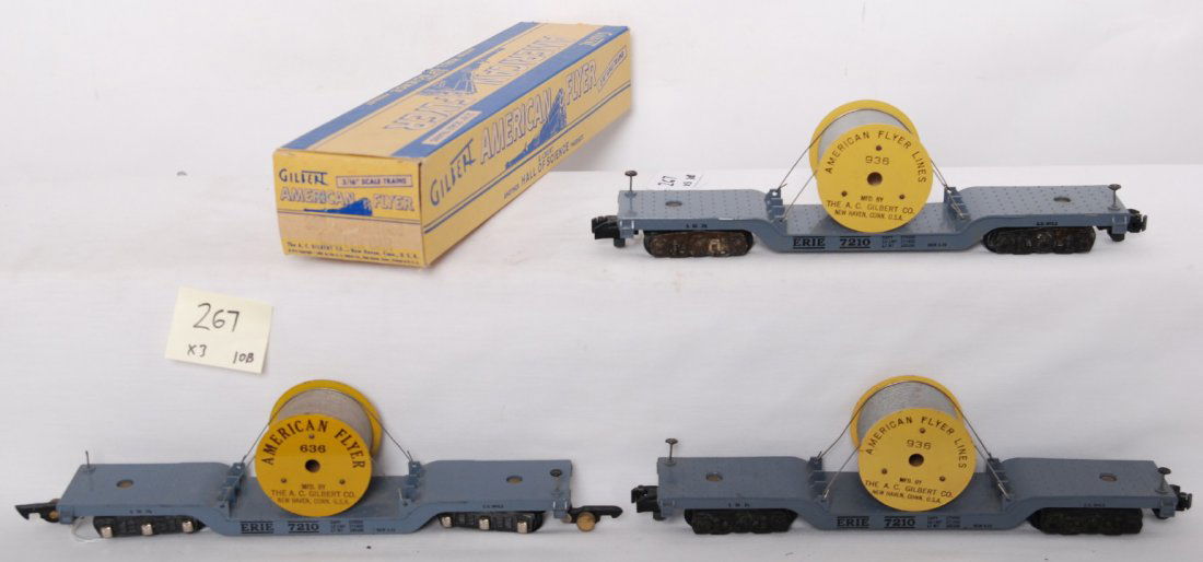 American Flyer Erie 636, 936, 936 flats: American Flyer postwar S gauge Erie depressed center flat cars with cable reels. Three cars include 636, 936, and 936 with box. Cars are C7+ with some wear to wheel sets, but nice bodies. One brake wh