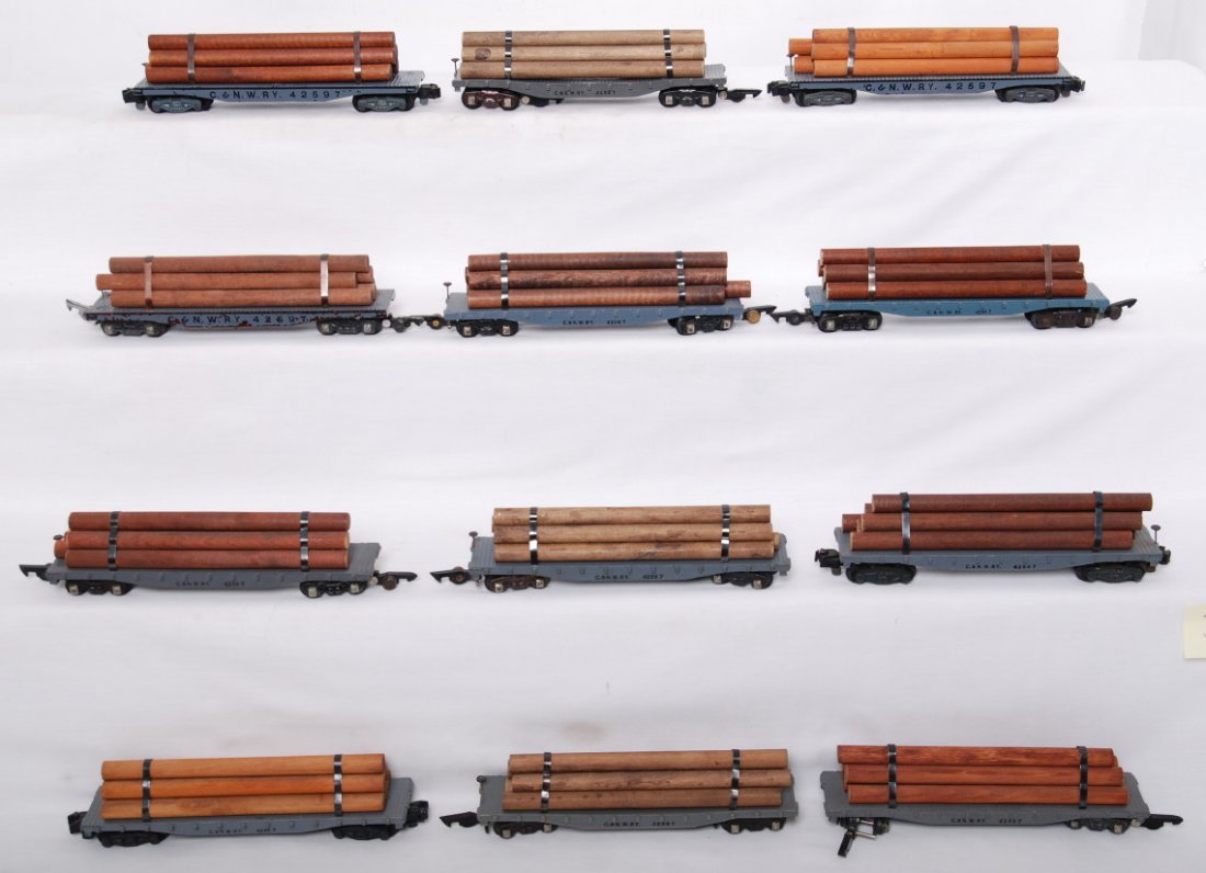 12 42597 / 628 C&NW flat cars: American Flyer postwar S gauge 628 /42597 Chicago and Northwestern flat cars with logs. Twelve cars total. Seven cars have diecast frames, two have plastic frame, and three are pressed wood. Cars rang