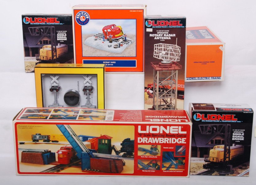 Lionel and Railking accessories 34144, 12749, 1276: Lionel modern O gauge accessories in OBs. Includes 34144 scrap yard, 2318 control tower, 12749 radar, two 12763 signal bridges, 2317 drawbridge in C7 condition, and Railking 11014 crossing with sound.