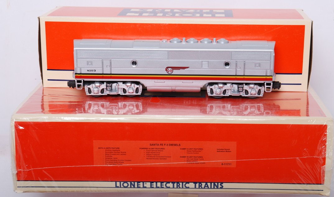 Lionel 11711 Santa Fe F-3 A-B-A sealed and 18103 B: Lionel modern O gauge 11711 Santa Fe F3 A-B-A diesel units factory sealed in OB wrapped in factory plastic, C10. Cello is ripped in a few areas. OB has some wear at the corners. Also includes 18103 du
