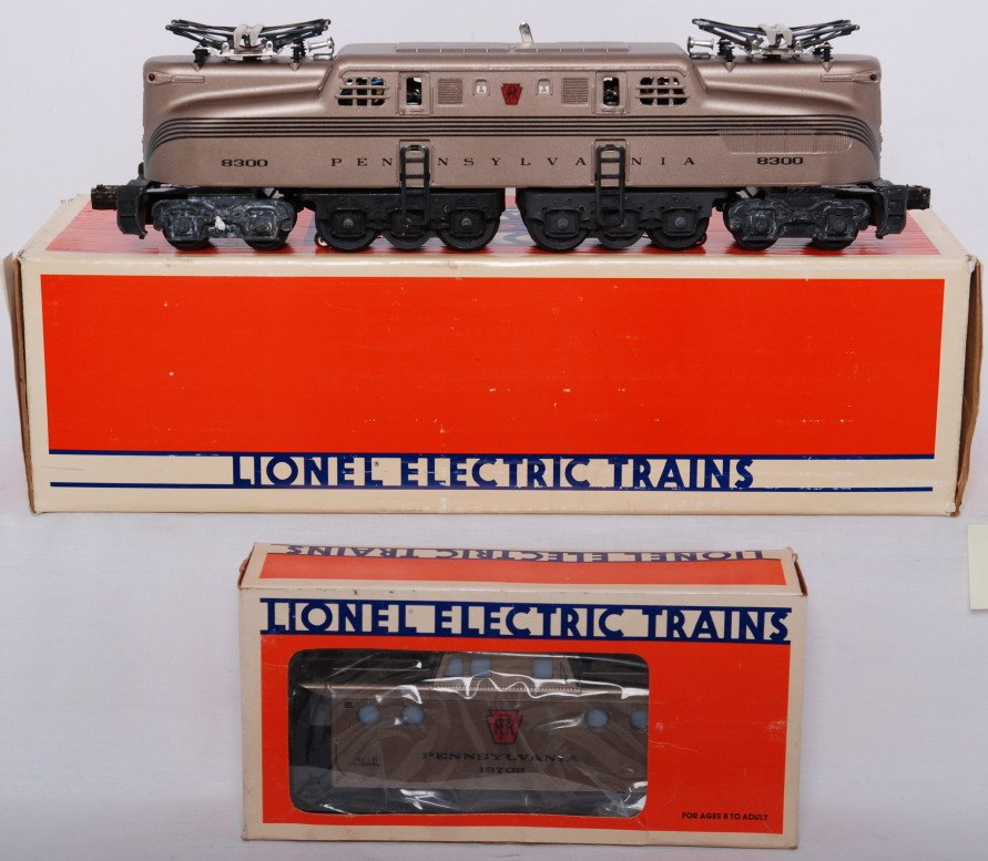 Lionel PRR Mint Series 18300 GG-1 and caboose: Lionel modern O gauge Pennsylvania Mint Series; 18300 GG-1 diesel loco in OB. The loco is C8 with run time. Also includes 19702 caboose. Caboose is C8-9 with very light run time. OBs have some light w