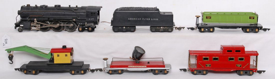 American Flyer O gauge steam freight set, 447: Prewar American Flyer O gauge 447 steam locomotive with unnumbered diecast tender, side dump car, operating work crane, searchlight car, and illuminated caboose. Trains have normal tarnish on trim, ot