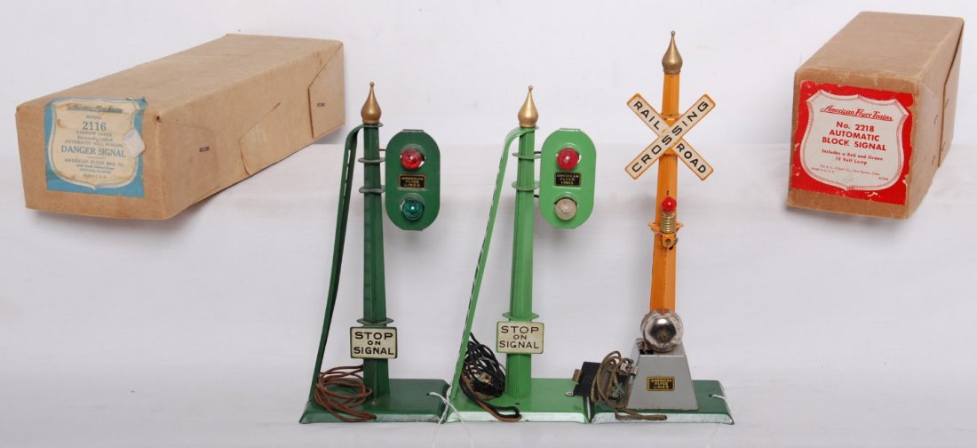 American Flyer 2116 in OB, two 2218 w/1 OB: Prewar American Flyer narrow/O gauge operating accessories with two original boxes. 2116 danger signal and two 2218 automatic block signals. Accessories should clean C7-8. 2116 and 2218 original boxes