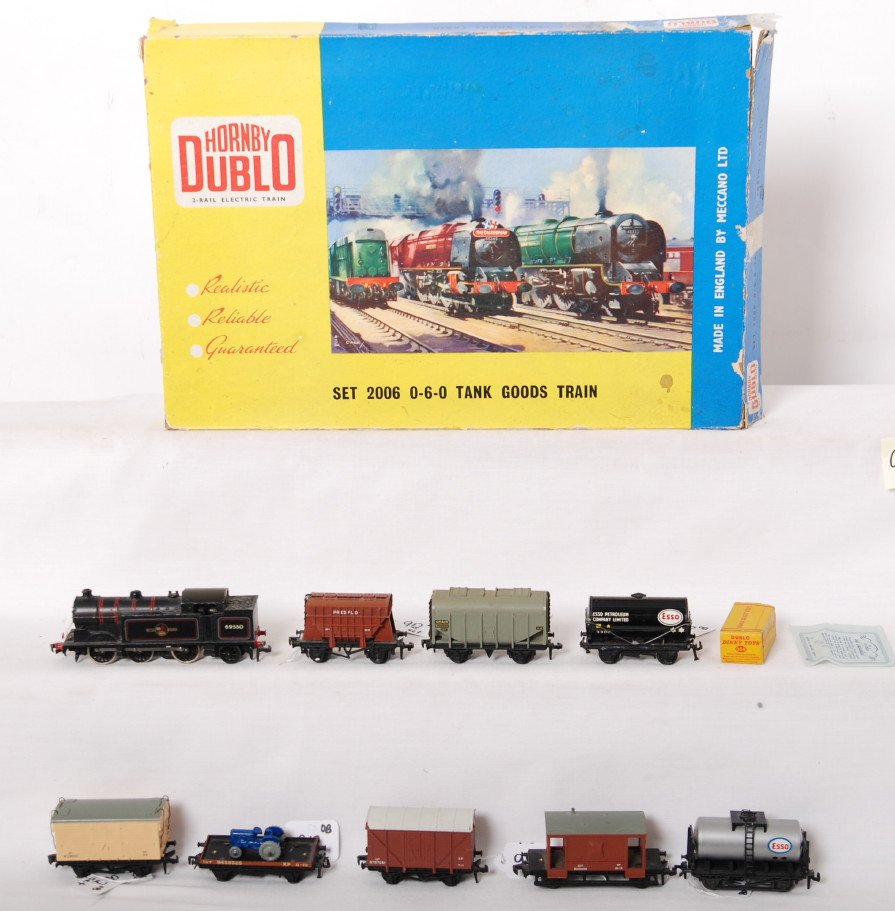 Hornby Dublo HO 2006 0-6-0 tank goods train in OB: Postwar Hornby Dublo HO gauge set number 2006 0-6-0 tank goods train in original box with divided interior. 69550 British Railways steam locomotive (0-6-2?), goods cars with a missing step and a parti