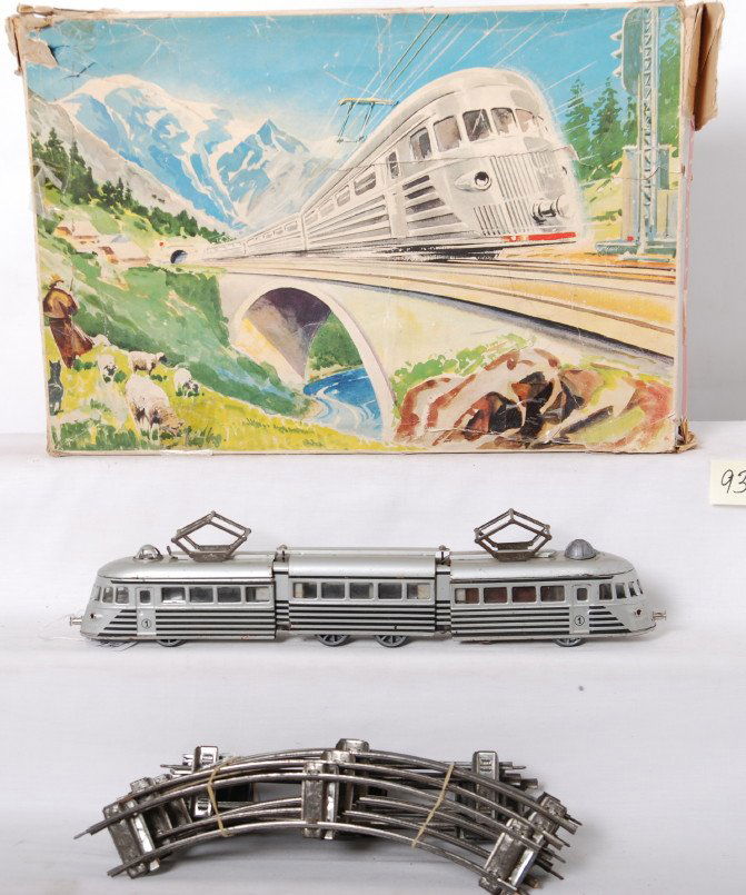 Joustra, French, battery op., litho., tinplate, st: Postwar Joustra, Made in France O gauge battery operated, lithographed tinplate streamline diesel articulated passenger train with track in original box with divided interior. Train has a rusted batte