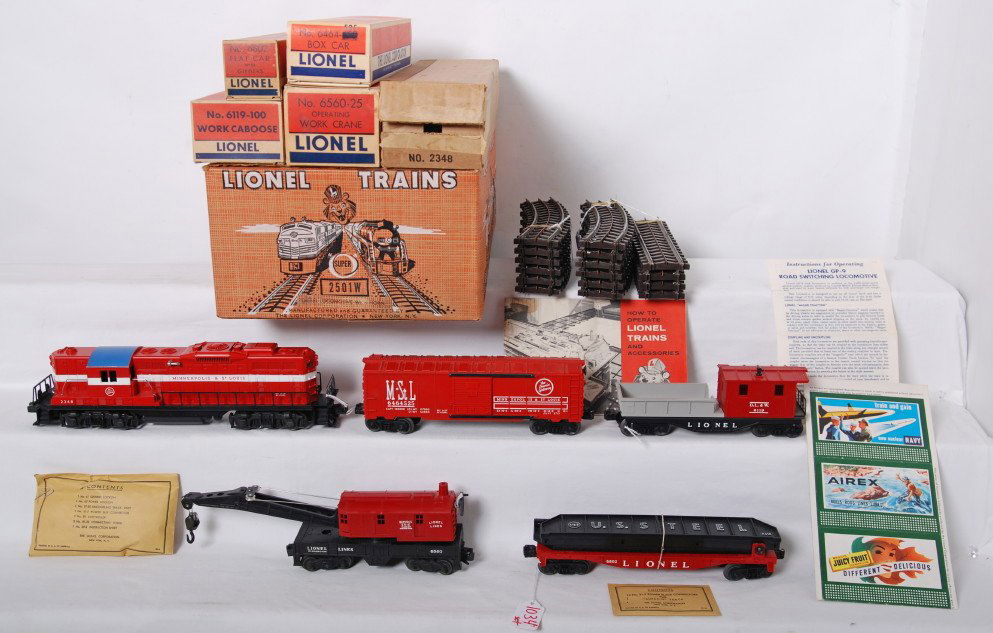 High grade Lionel postwar 2501W set, 2348 MStL: Lionel postwar O gauge set 2501W with an outstanding high grade set box. Trains include 2348 MStL GP gray mold variation, 6560-25 crane, 6802 flat with girders, 6464-525 MStL boxcar on a type IIb body