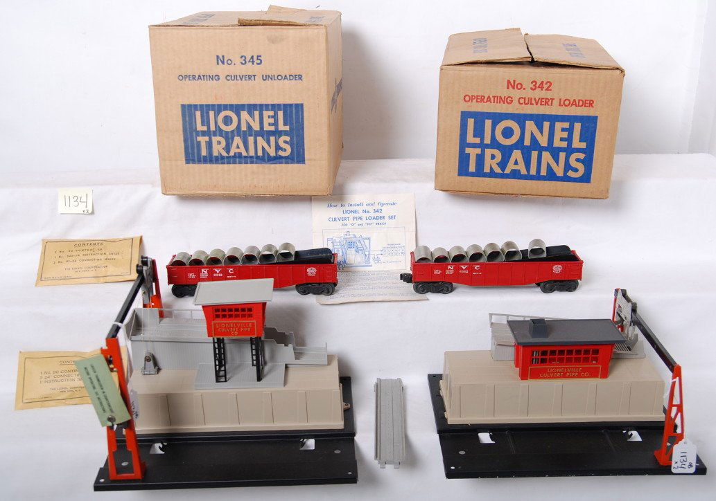 Lionel 342 & 345 culvert loader & unloader in OB: Postwar Lionel O gauge operating accessories in original boxes with inserts, instructions sheets, envelopes, components, etc. 342 operating culvert loader and 345 culvert unloader. Accessories look C8