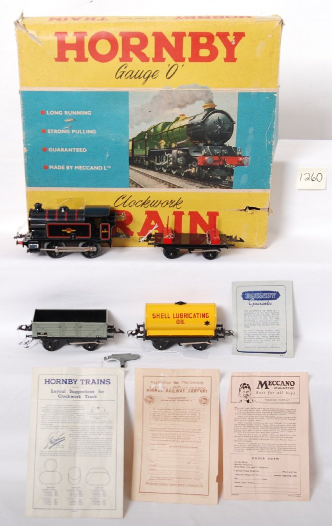 Hornby Gauge O Clockwork No. 45 tank goods in OB: Postwar Hornby Gauge O Clockwork No. 45 tank goods train set in original box with divided interior, paper literature, and track sections. Train is comprised of: Hornby type 40 3/82011 British Railways