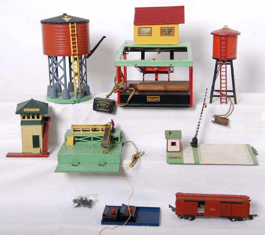 American Flyer 751, 596, 591, 770, etc: American Flyer postwar S gauge accessories. Includes 751 log loader, 596 water tower, 591 crossing gate, 770 operating platform and 734 operating boxcar, prewar water tower with light, and Cedar Hill