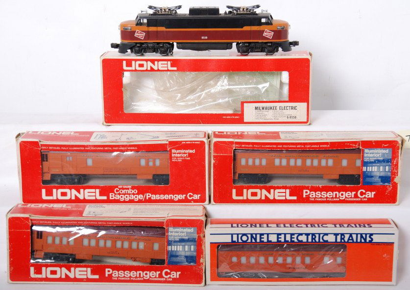 Lionel Milwaukee Road EP-5 and passenger cars: Lionel modern O gauge Milwaukee Road 8550 EP-5 shell on postwar EP-5 frame. Loco has light paint chips, etc C7. Passenger cars include 9505 Seattle coach, 19003 Milwaukee Road dining car, 9504 Tacoma