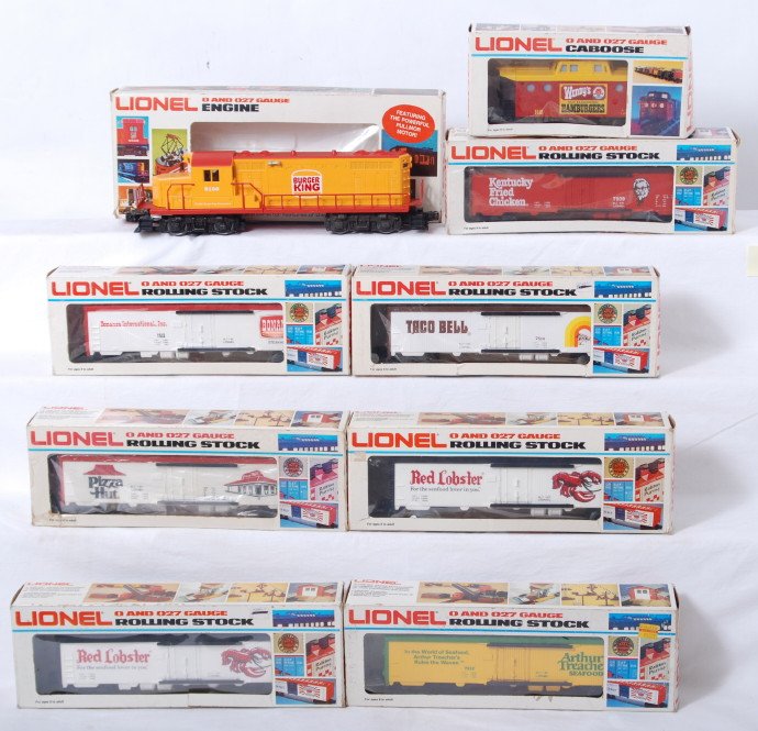 Lionel Fast Food Express 8160, 7514, Etc.: Lionel modern O Gauge fast food express set in OBs Includes 8160 Burger King GP20 with 7509 Kentucky Fried Chicken, two 7510 Red Lobster, 7512 Arthur Treacher, 7513 Bonanza, and 6449 Wendy's caboose. 