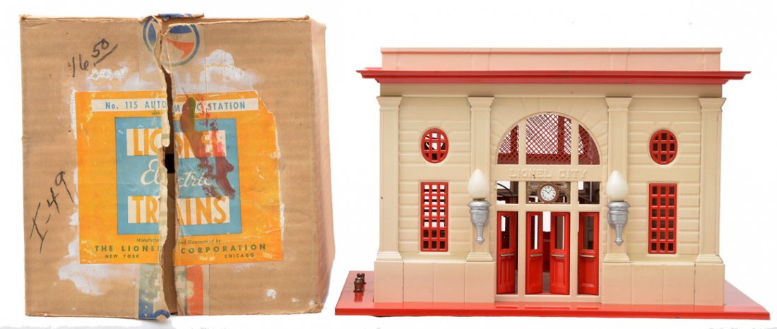 Lionel Std. Ga. 115 Lionel City Station OB: Lionel prewar standard gauge 115 automatic Lionel City station with red base and trim, ivory walls and aluminum light fixtures in OB. The paint on the station is bright and clean however does have a f