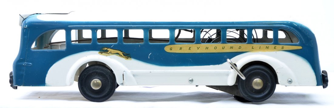 Buddy L Model 855 Wind Up Greyhound Lines Bus: Buddy L model 855 Greyhound Lines bus with wind up mechanism, circa 1939, C7. This bus was from the Rick Ralston collection.