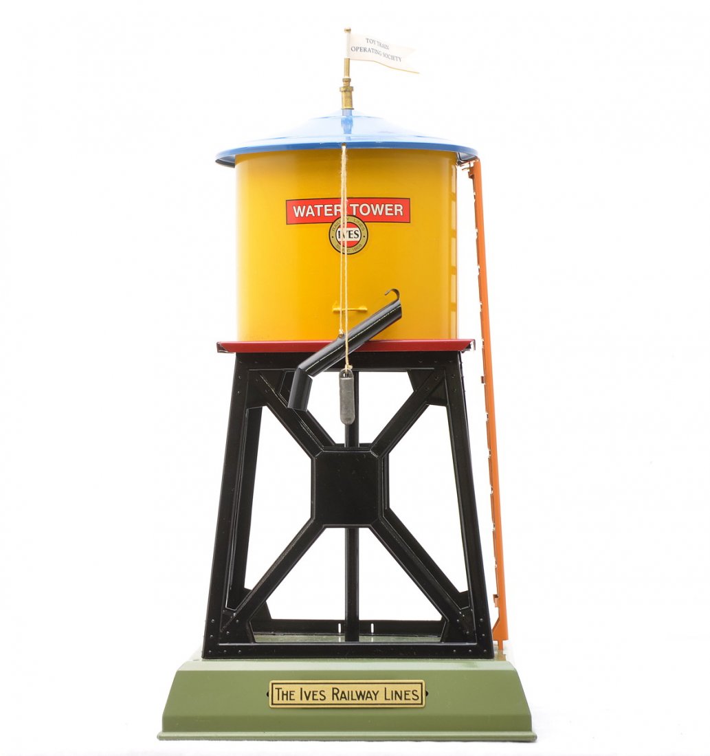 Ives Reproduction 89 Water Tower by Lyle Cain: Ives reproduction of an 89 water tower made by Lyle Cain L.C. Enterprise of Hollywood, California. The water tower has a yellow tank with decal, blue roof, orange ladder, black tower and a green base.