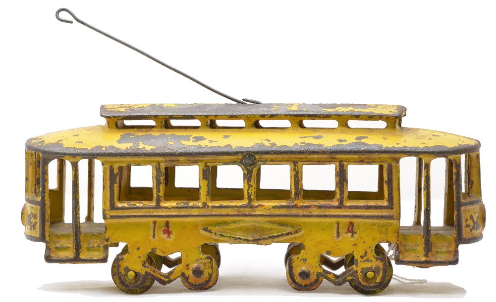 Jones & Bixler Cast Iron Yellow no. 14 Trolley: Jones & Bixler cast iron yellow trolley numbered 14, circa 1907-08. This trolley is the double door model with painted red numbers and headlights. Trolley has paint flaking, C5. This trolley is from t
