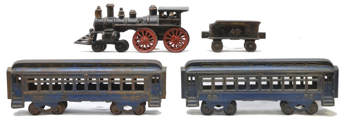 Jones & Bixler Cast Iron Floor Toy Train Set 374: Jones & Bixler cast iron floor toy train set no. 374, circa 1910 including; no. 49 loco, no. 49 tender and two no. 90 blue coaches. The loco is C6 and the tender and cars are C5. This set was from the