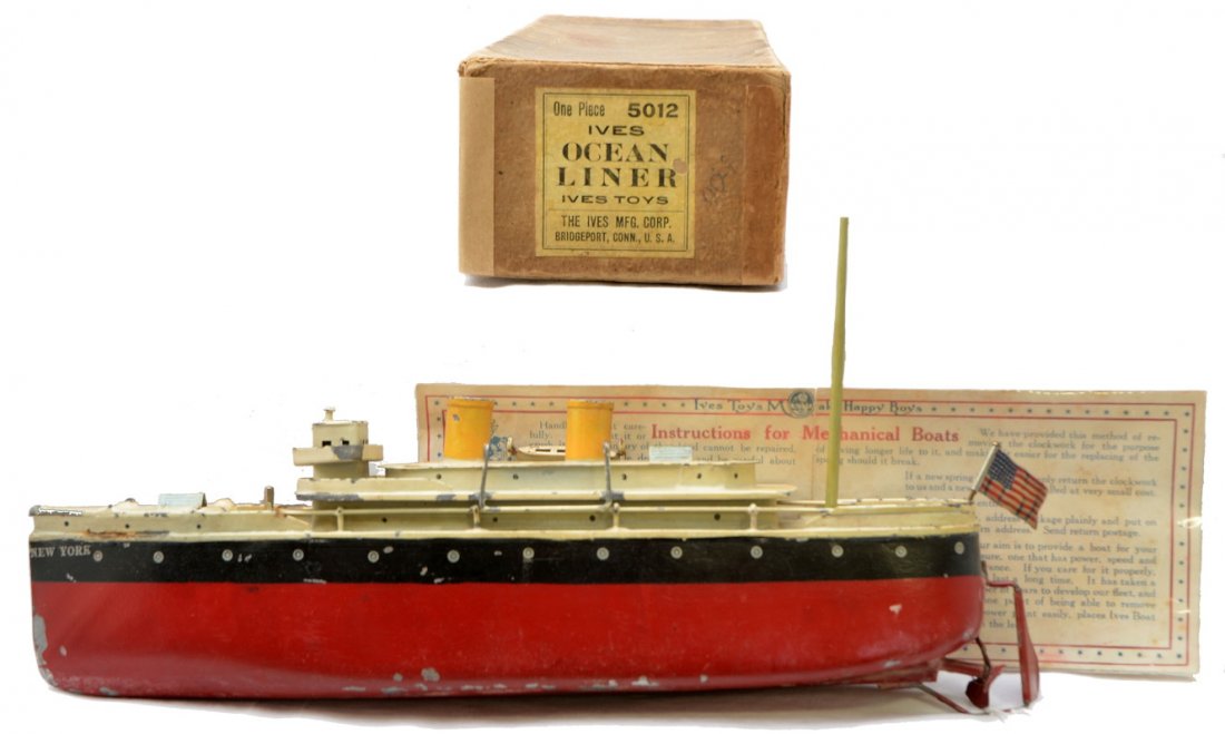 Ives No. 5012 Toy Ocean Liner Boxed: Ives no. 5012 toy twelve inch clockwork New York ocean liner with original instruction sheet in OB, circa 1921-22. The ocean liner is missing a life boat. The boat is C5. The OB is complete and has th