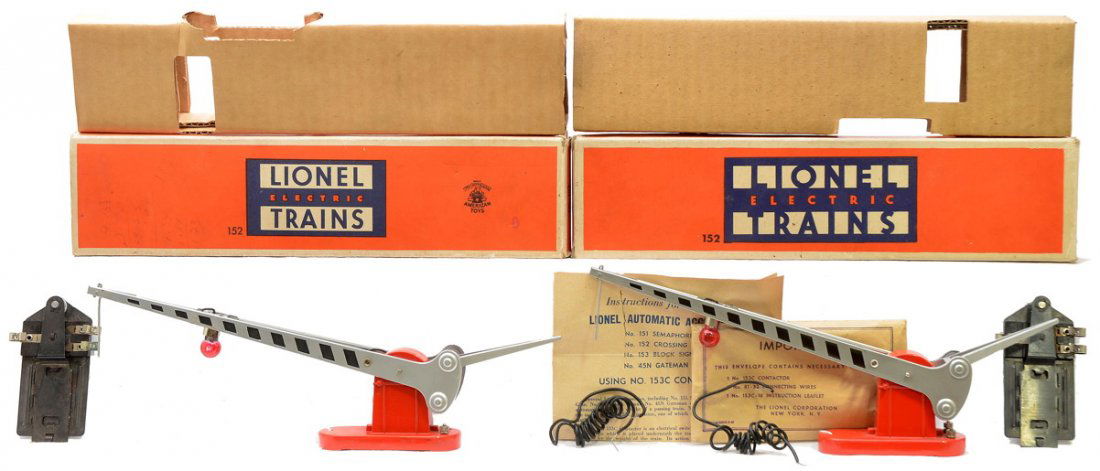 Lionel two 152 Automatic Crossing Gates LN OBs: Lionel postwar two 152 automatic crossing gate, one with a packet, three wires, 153C contractor and instruction sheet and one with a 153C contactor both in OBs that has original cardboard inserts. The