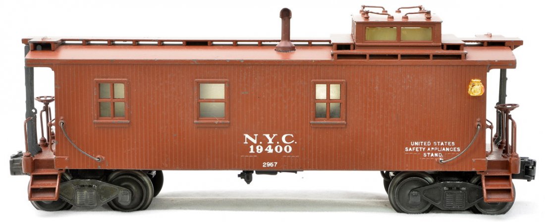 Lionel 2957 NYC Caboose w/Postwar Trucks: Lionel 2957 New York Central Semi scale caboose with early coil couplers and whirly wheels. This caboose was sold with the Berkshire freight set no. 2113WS, circa 1946. The theory that most collectors