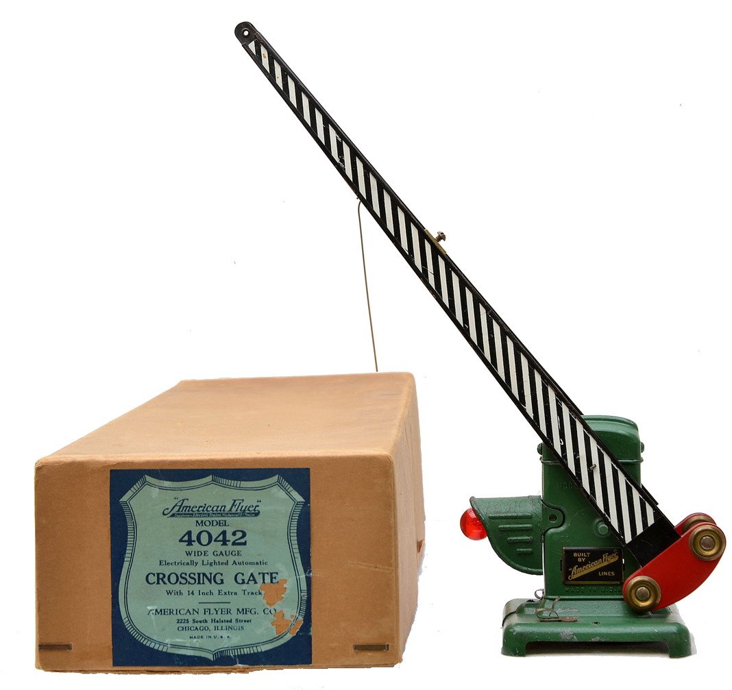 Am Flyer Prewar 4042 Crossing Gate Boxed: American flyer prewar wide gauge 4042 crossing gate in OB. The die cast base is solid and intact. The die cast hood above the light does have some crazing. Gate is C7. The OB has no split corners and