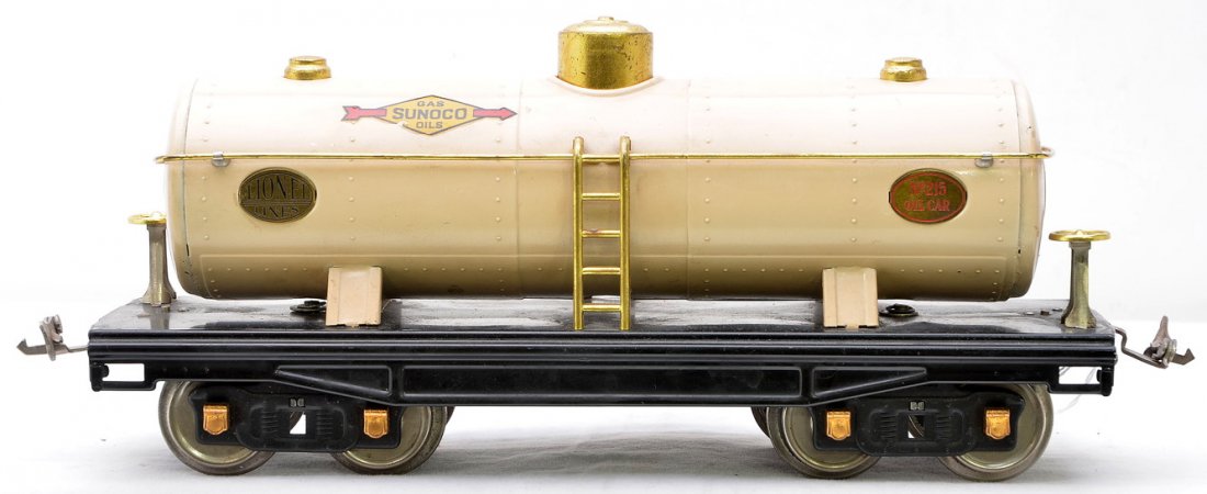 Lionel Prewar Std. Ga. Ivory Sunoco Tank Car: Lionel prewar standard gauge 215 ivory Sunoco tank with brass trim and copper journals. This is the version with two Sunoco decals and brass plates that have a mixture of black and red lettering. Both