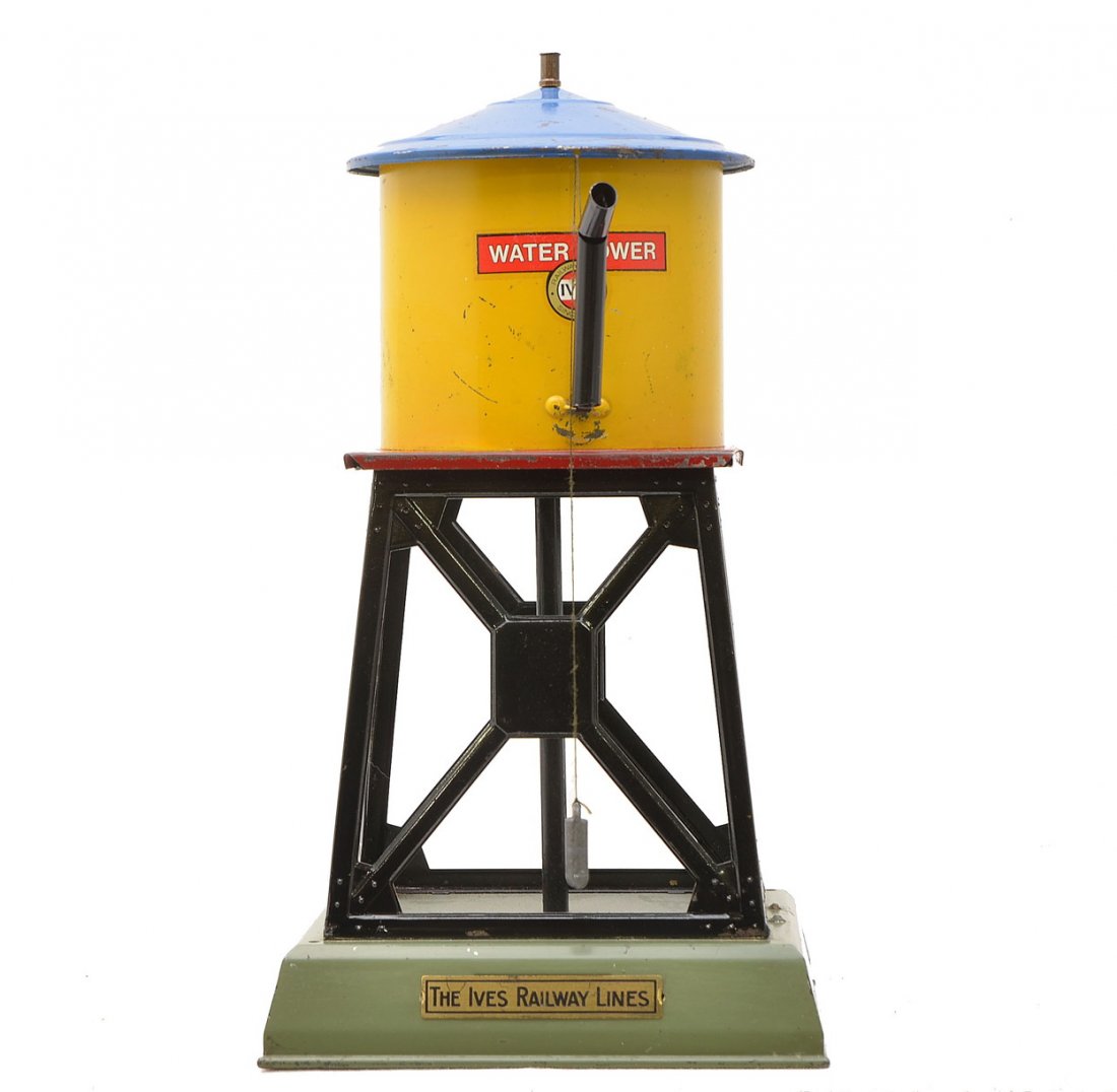 Scarce Ives 89 Water Tower w/Yellow Tank: Scarce Ives prewar wide gauge no. 89 water tower, circa 1930 with yellow tank that is decaled, blue roof, black tower, green-gray base and brass plate. The tower is missing the ladder and is C5.