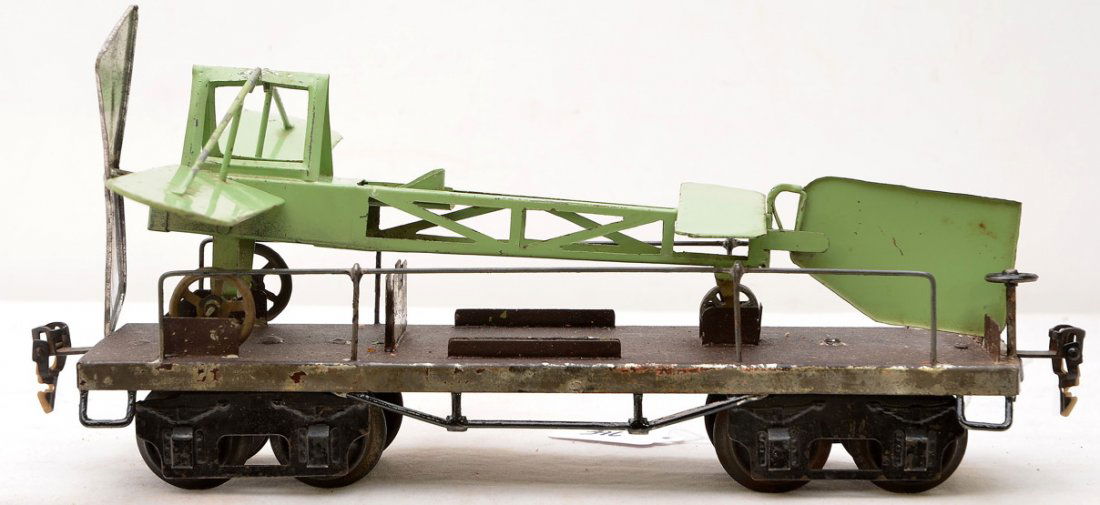 Marklin 1881 Aircraft Transport w/Airplane: Marklin prewar gauge 1 no. 1881 aircraft transport flatcar with airplane, circa 1913-16. The airplane is green with folding wings. The plane is a model of the real airplane first manufactured in 1912