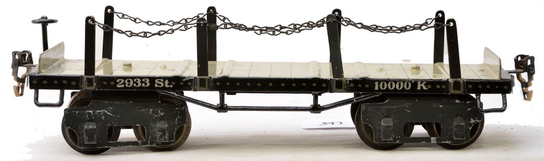 Marklin 2933 Black Log Flatcar w/Stakes & Chains: Marklin prewar gauge 1 2933 black log flatcar with four stakes and chains on each side. The car does not have the logs and has some paint touch ups. Car is C6.