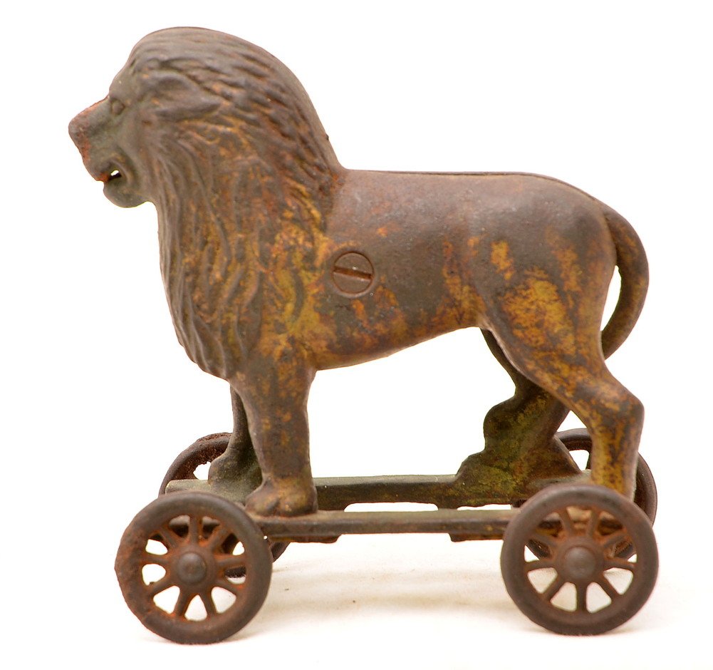 A C Williams Cast Iron Circus Lion Bank on Wheels: A. C. Williams Co. from Ravenna, Ohio cast iron Circus lion bank on wheels. Most of the gold paint is worn off of the lion. The lion bank is C5.
