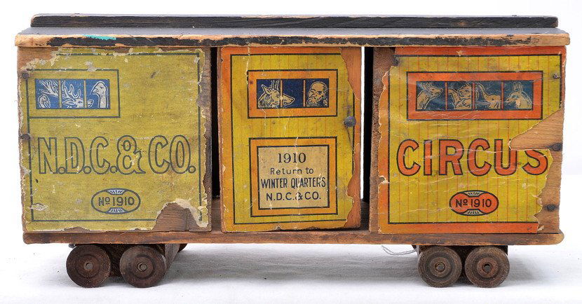 Gibbs Mfg. Canton Ohio Wooden Circus Train Car: Gibbs Mfg. Co. from Canton, Ohio wooden Circus Animal train car, circa 1910. The train car has colorful lithographed paper applied to it which has flaked off in some areas.
