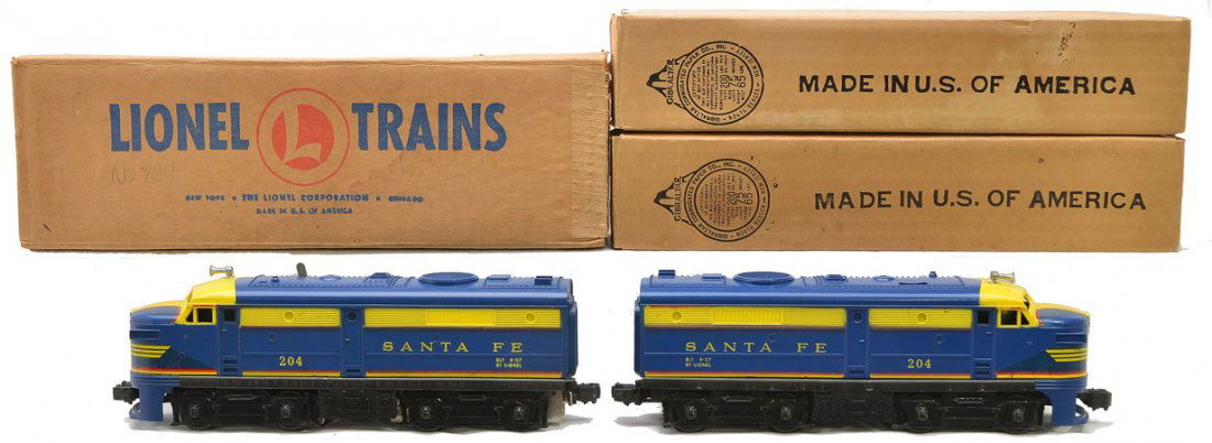 Lionel 204P/T Santa Fe Alco AA Diesel Units OBs: Lionel postwar 204P/204T Santa Fe Alco AA diesel units in individual OBs and master carton. Both nose decals on the Alcos are intact with some cracking on the top of the cab nose. Engines are C8. The