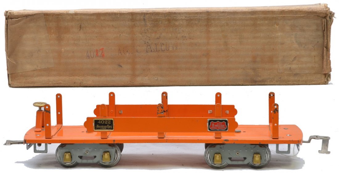 Am Flyer 4022 Orange Machinery Car Boxed: American Flyer prewar wide gauge 4022 orange machinery car with orange side bars, gray set trucks, brass trim and journals and Over 8 Million plates in OB, C7. OB is missing two interior flaps. The la