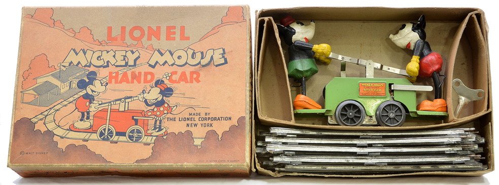 Lionel 1100 Green Mickey Mouse Hand Car OB: Lionel prewar O gauge no. 1100 apple green Mickey Mouse clockwork hand car with original key and eight curve track sections in original OB that has original cardboard insert. The hand car is C7-8. The