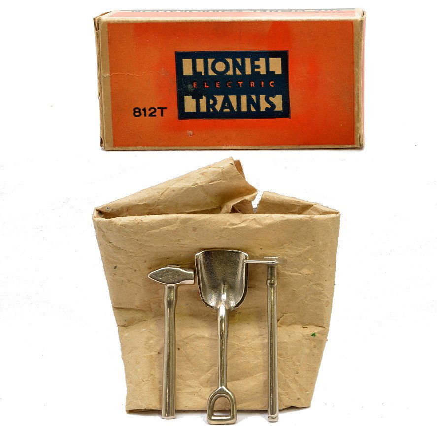 Lionel Prewar 812T Tool Set MINT Boxed: Lionel prewar O gauge 812T tool set in OB with original paper wrap. The set contains nickel plated cast iron tools including a hoe, shovel and sledge hammer. The tools are C9-10. The box has all flaps