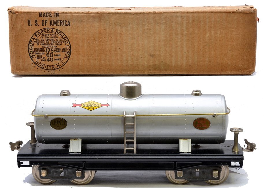 Lionel Std. Ga. 215 Silver Sunoco Tank Car Boxed: Lionel prewar standard gauge 215 silver Sunoco tank car with brass plates and handrails, nickel domes, ladders, brake wheels and journals. in OB. The 215 Oil Car plates have red lettering and the Lion