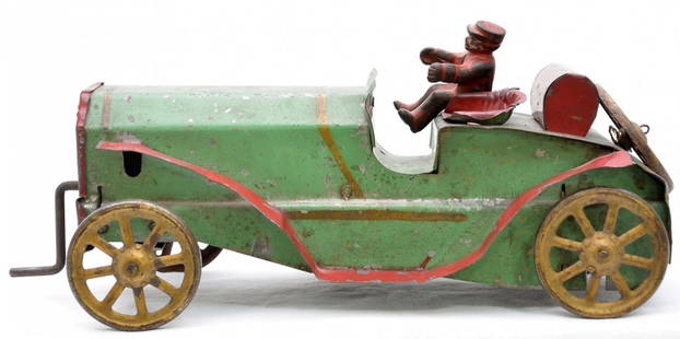 Schieble Toy & Novelty Co. Wind Up Car: SchiebleToy & Novelty Co. Dayton, Ohio auto that has a spring loaded wind up motor with crank, C5. Included with the car is a cast iron driver. The front axle on the car turns.