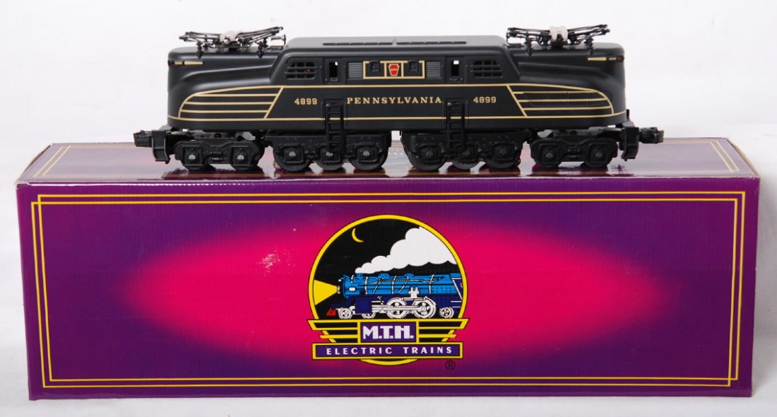 MTH Pennsylvania MT-5103L GG1: MTH modern O Gauge Pennsylvania GG1 in OB. Catalog number is MT-5103L. Loco features horn, directional lighting, dual motors, and much more. Loco is C8 condition with some run time. OB has very light 