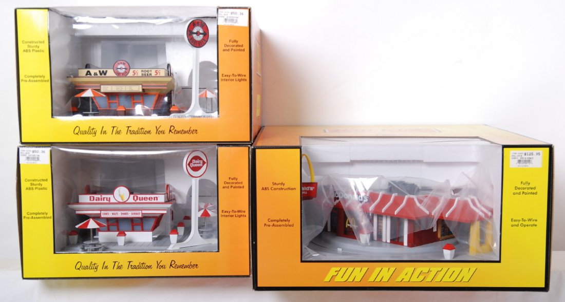 Railking operating McDonalds, Dairy Queen, A&W: MTH Railking modern O gauge accessories in OBs. Three items include 30-9114 operating McDonalds, 30-9069 Dairy Queen, and 30-9068 A&W. C9-10.