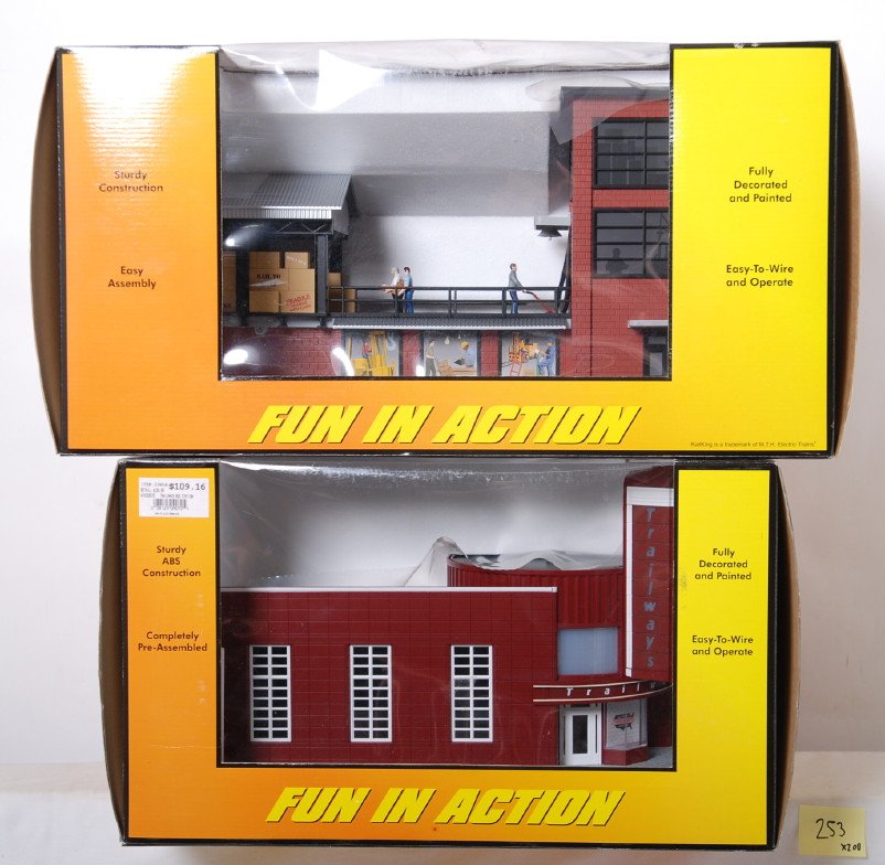Railking operating transfer dock and Trailways bus: MTH Railking modern O gauge accessories in OBs. Includes 30-9110 operating transfer dock and 30-9070 Trailways bus station. C9-10. OBs have light corner and edge wear.