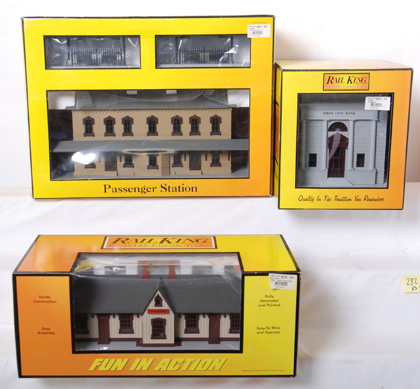 Railking buildings two stations and bank: MTH Railking modern O gauge buildings in OBs. Includes 30-9050 cream and brown passenger station, 30-9051 Meyerstown passenger station, and 30-9017 first town bank. C9-10.