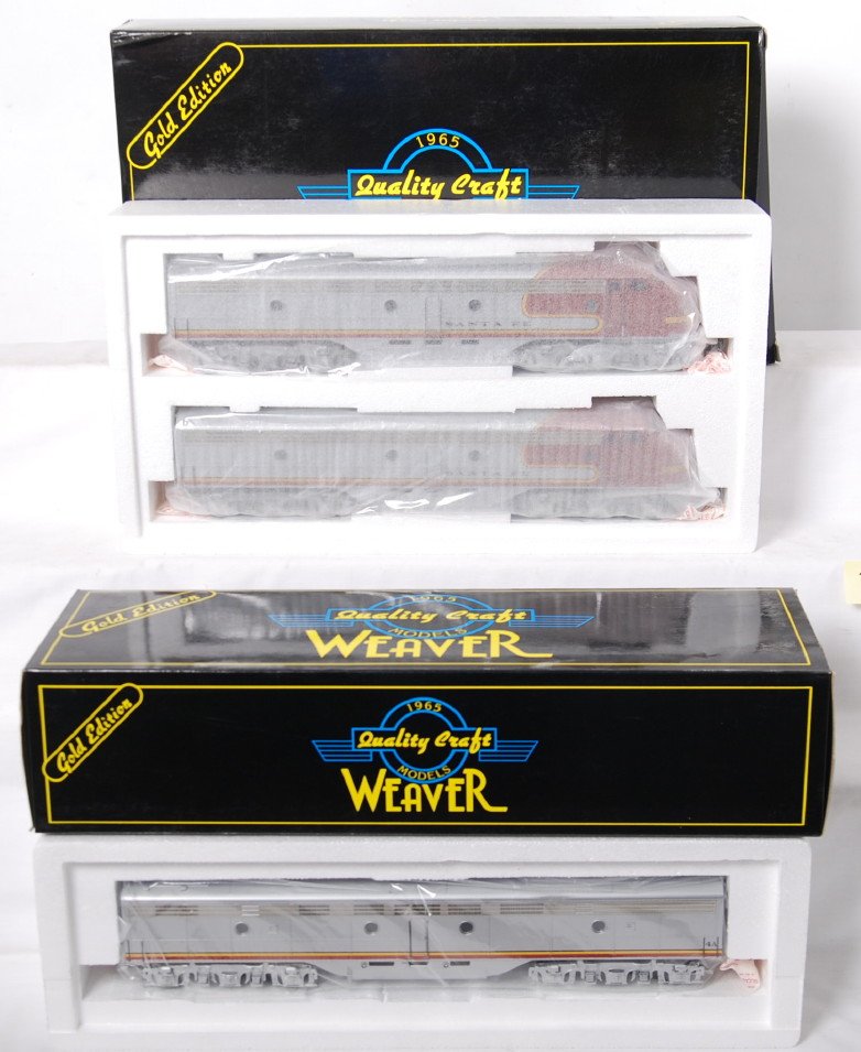 Weaver Santa Fe E-8 A-B-A: Weaver modern O gauge Santa Fe D EMD E-8 A-B-A diesel locomotive pair in OB. Locos features dual motors, constant voltage headlights, and more. Locos are factory wrapped in the inner box OB C10. Box h