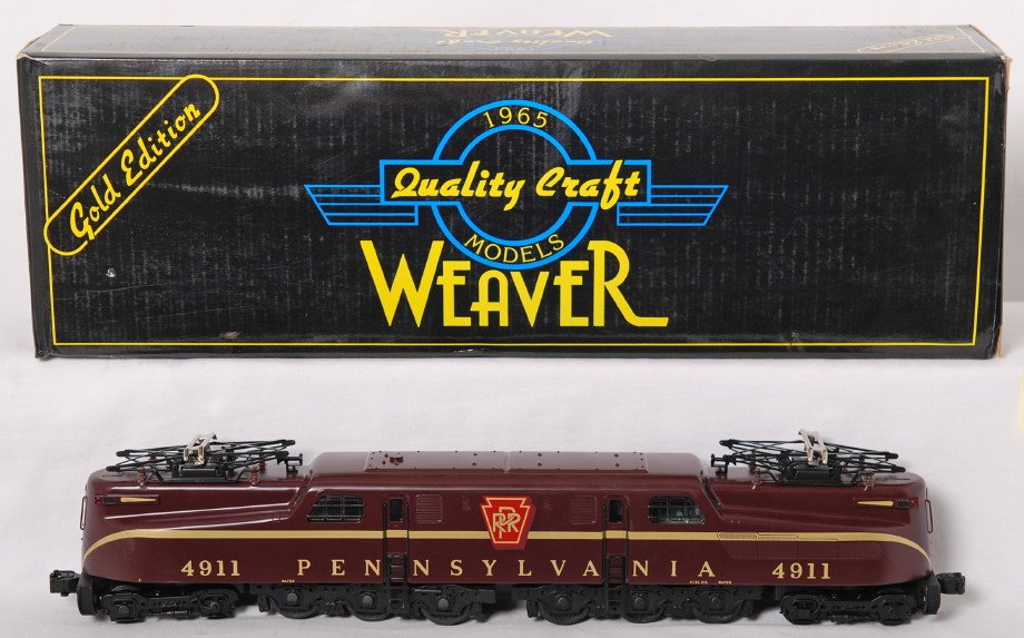 Weaver Pennsylvania Tuscan solid stripe GG-1: Weaver modern O gauge Pennsylvania Tuscan solid stripe scale GG-1 on OB. Loco features brass body construction, dual motors, constant voltage lighting, etc. Loco is C8 with run time. Locomotive origin